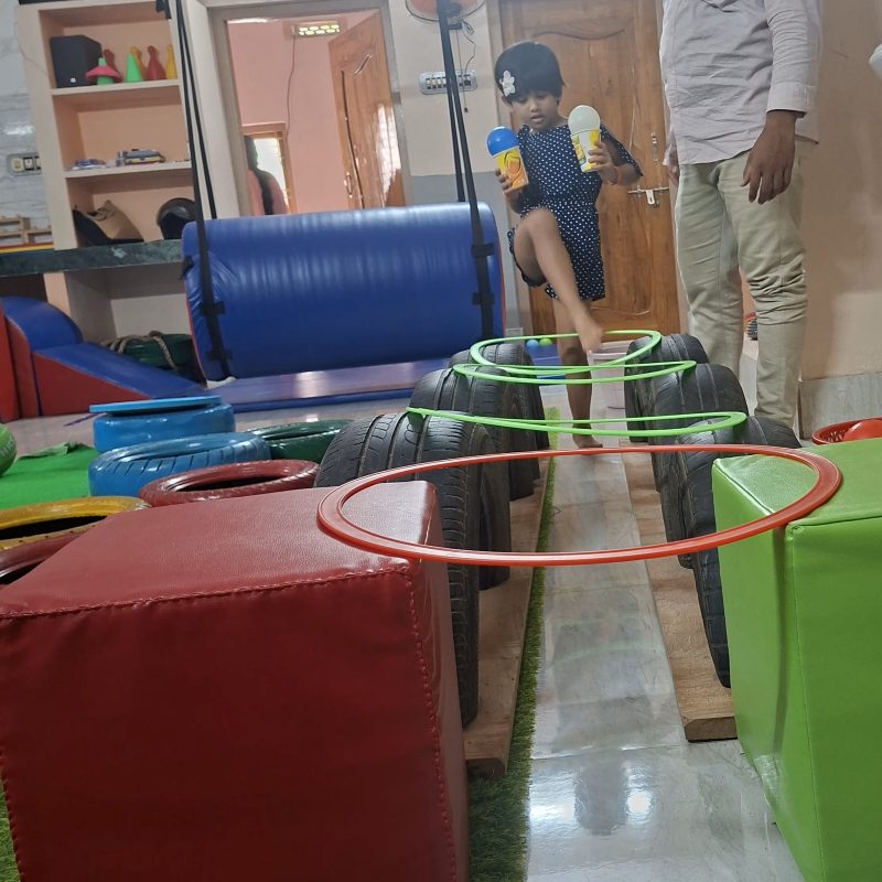 Child playing with toys in therapy room